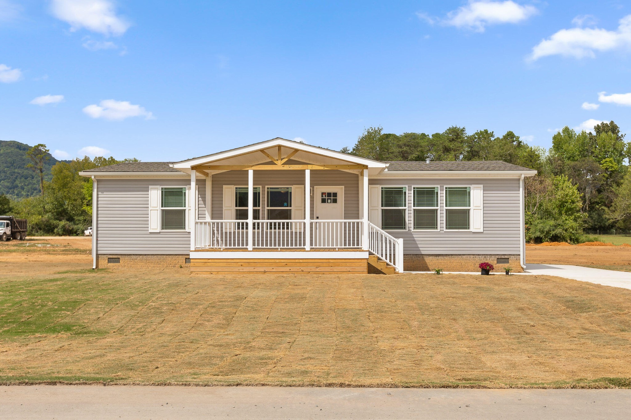 a front view of a house with a yard