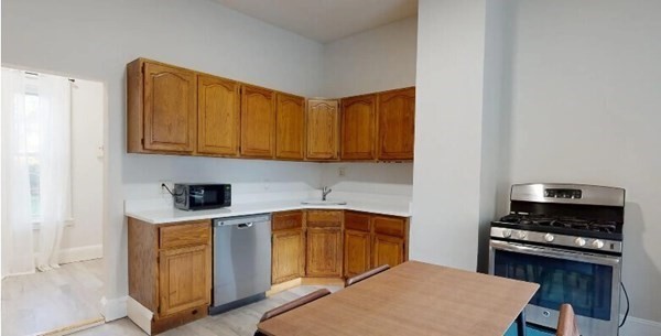 a kitchen with a stove and a microwave