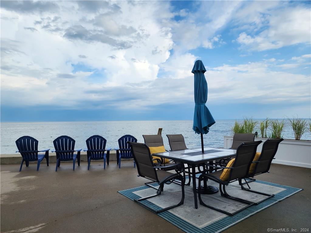 a view of a dinning table and chairs in the terrace