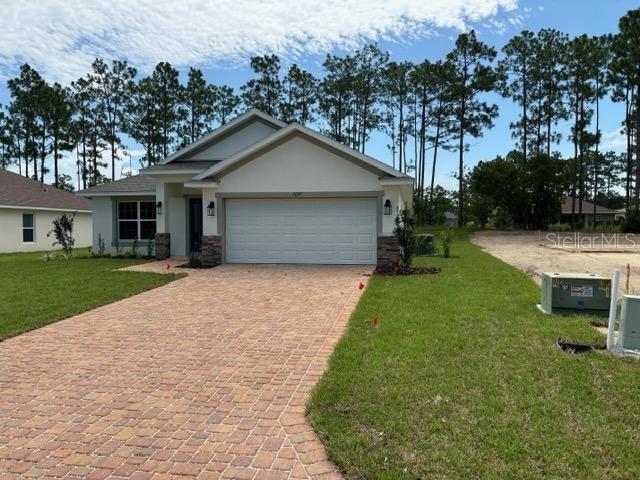 a front view of house with yard and green space