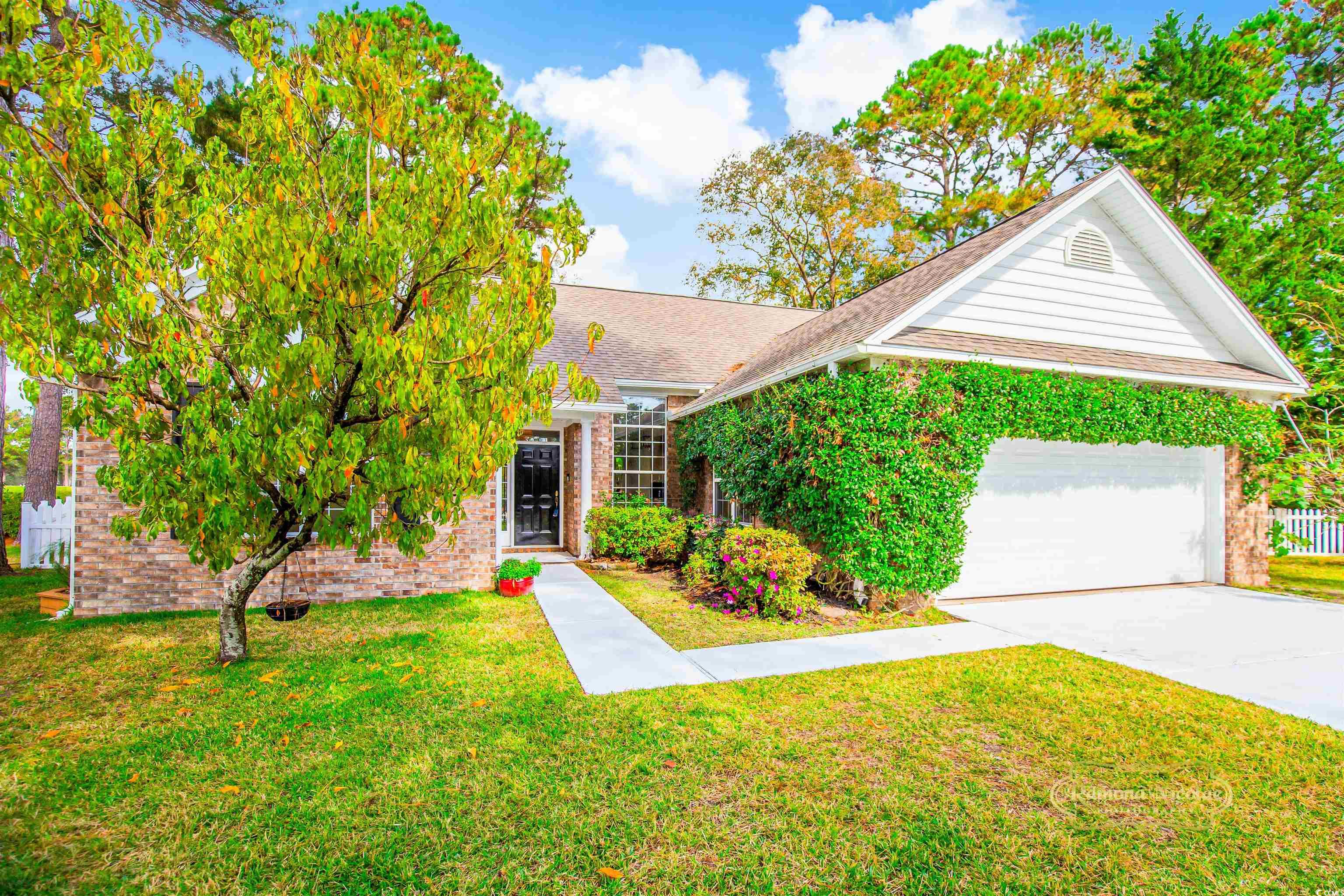 Obstructed view of property featuring a front yard