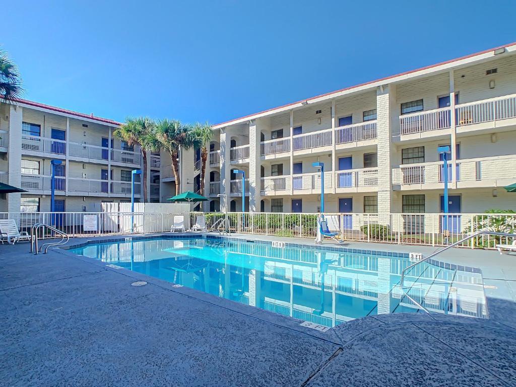 a view of pool with outdoor seating