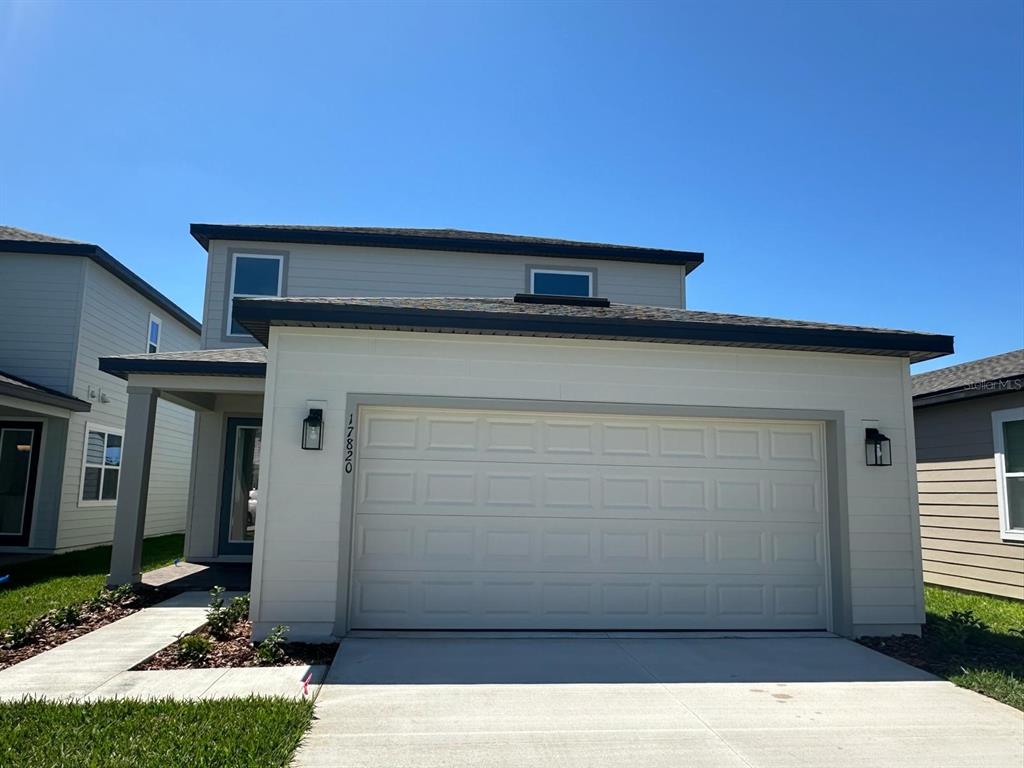 a side view of a house with garage