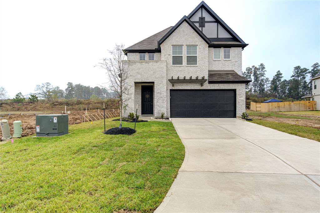 a front view of a house with yard