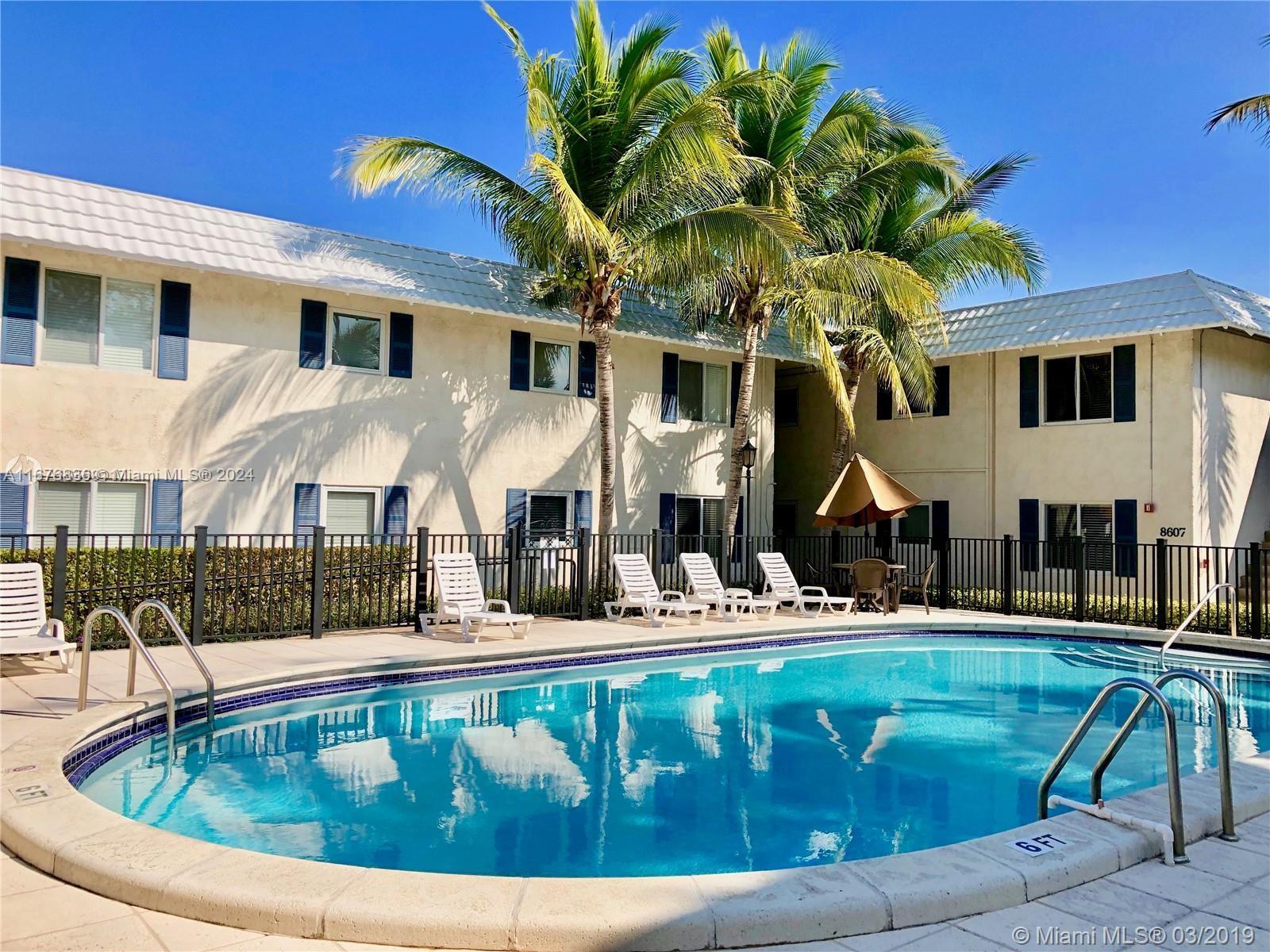 a view of a house with swimming pool