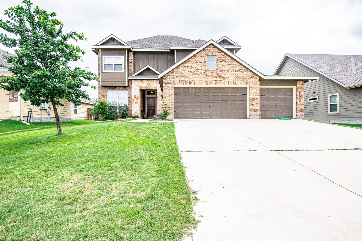 a front view of a house with a yard