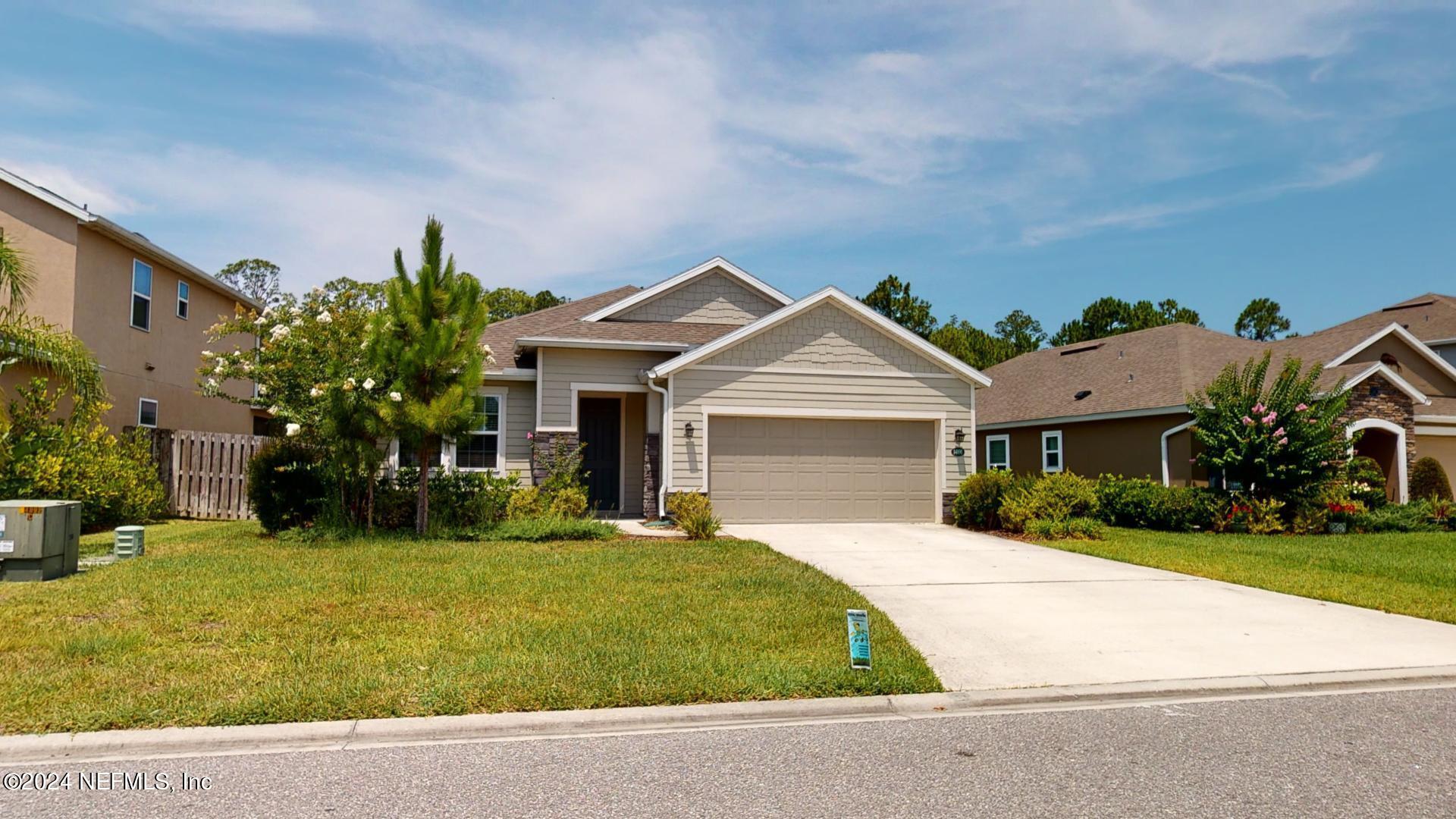 a front view of a house with yard