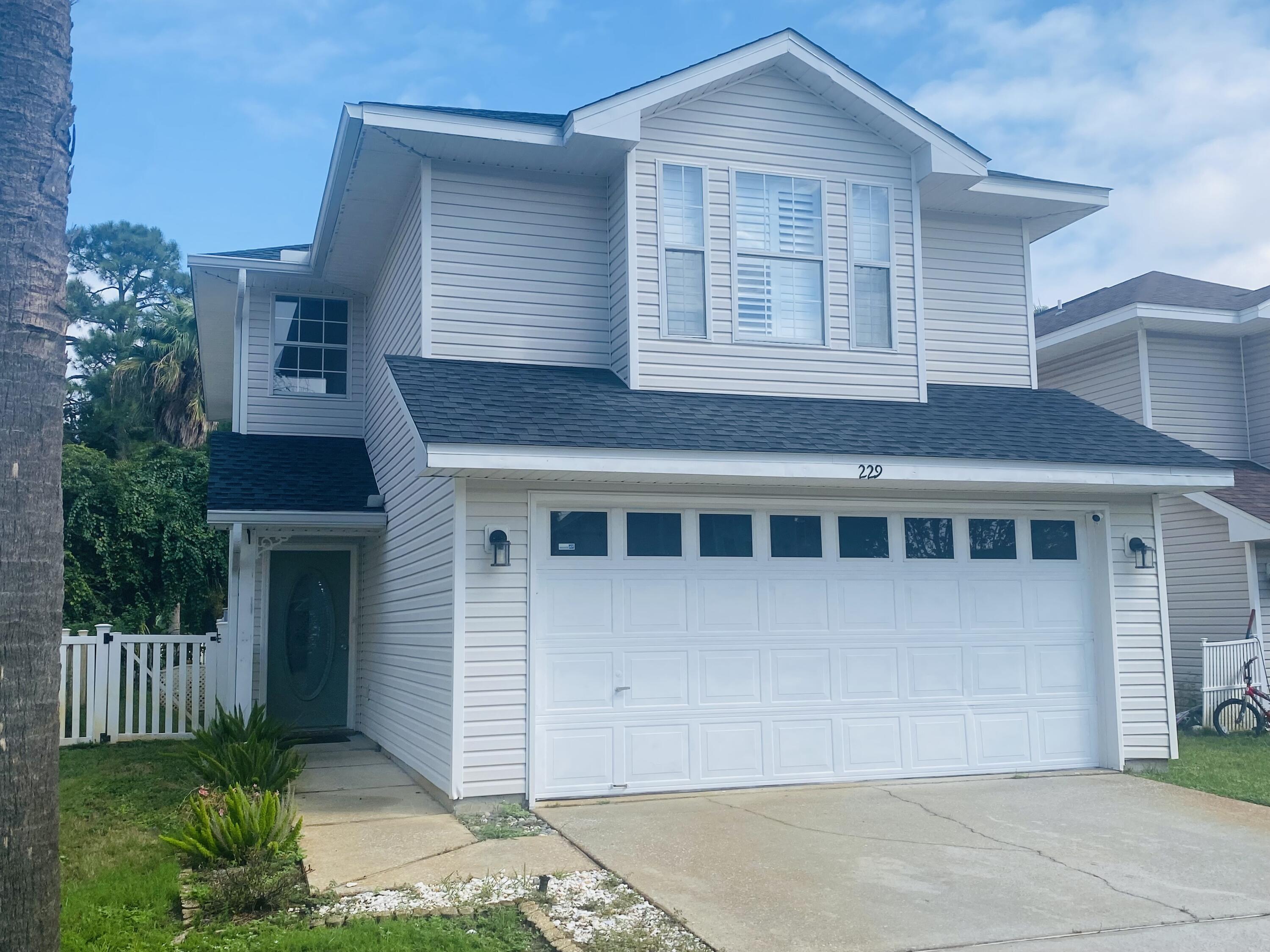 a front view of a house with a garage