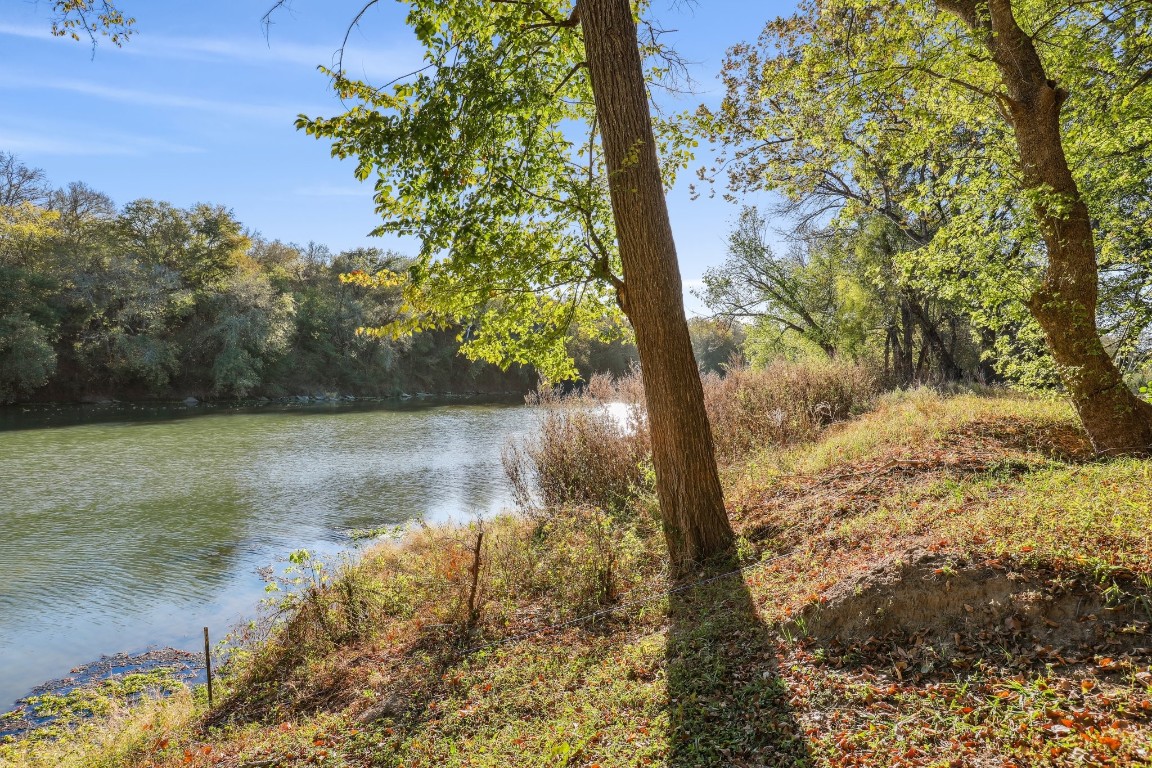 a view of a lake with a yard