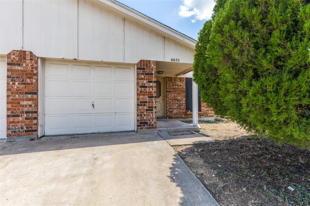 a view of a house with a garage