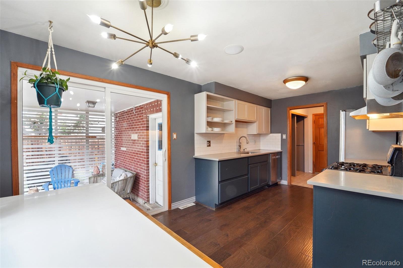 a large kitchen with kitchen island a sink stainless steel appliances and cabinets