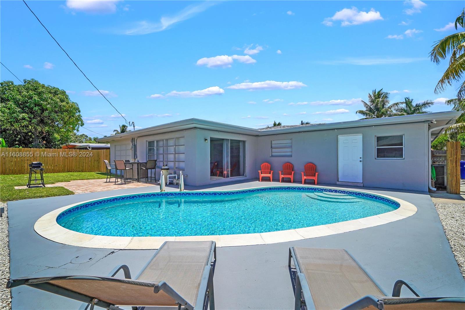 a view of a swimming pool with a patio