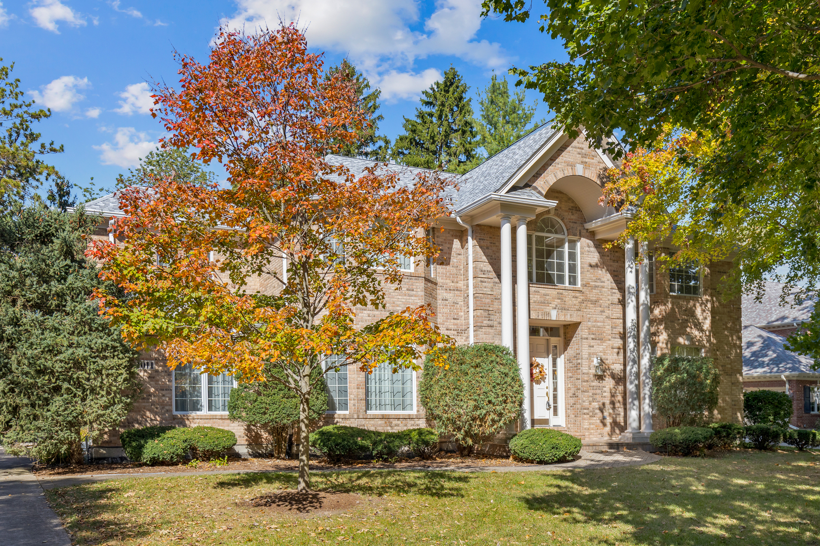 front view of a house with a yard