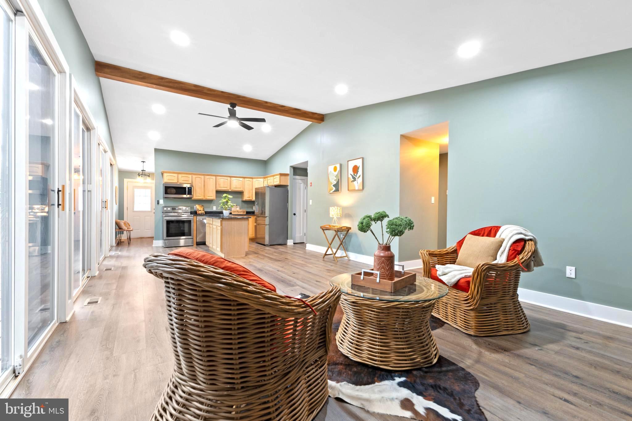 a dining room with furniture and wooden floor