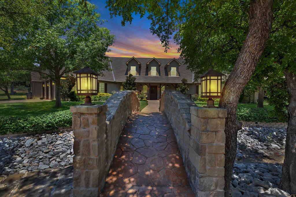 a view of a house with brick walls