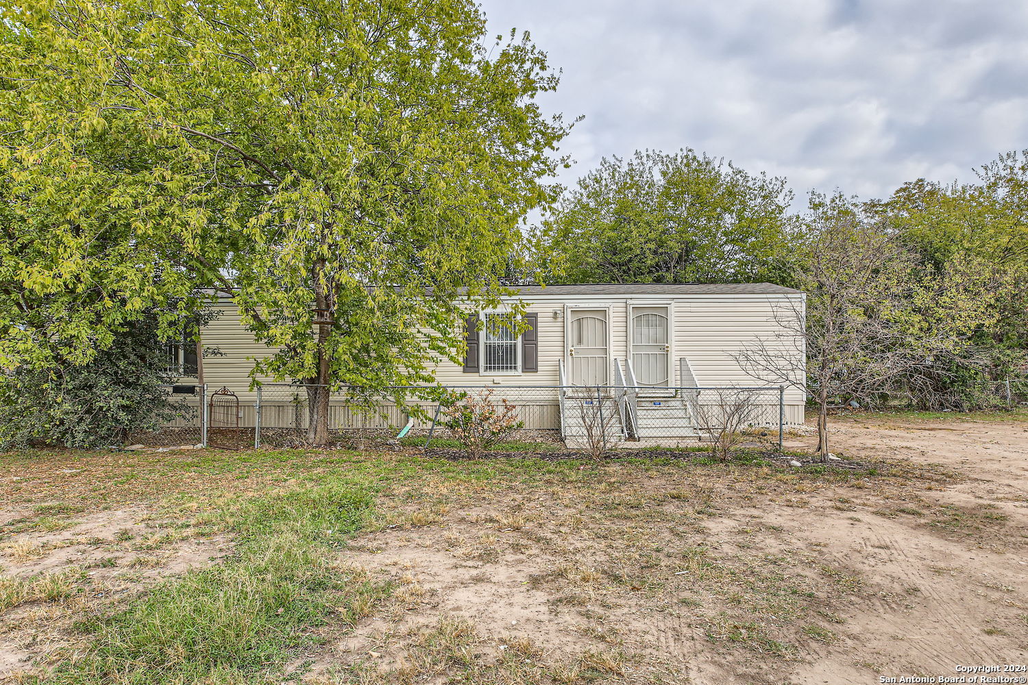 front view of a house with a yard