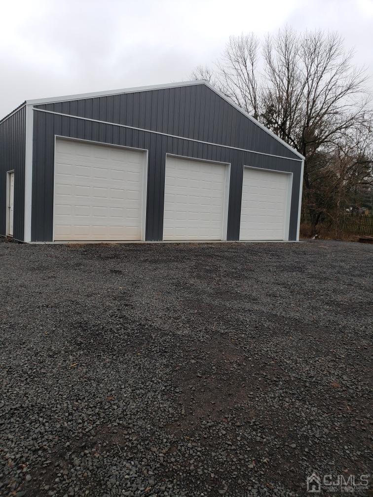 a front view of house with garage