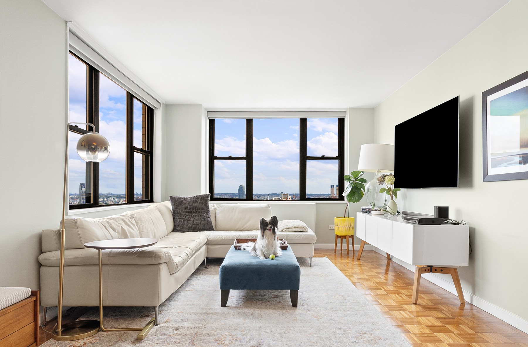 a living room with furniture and a flat screen tv