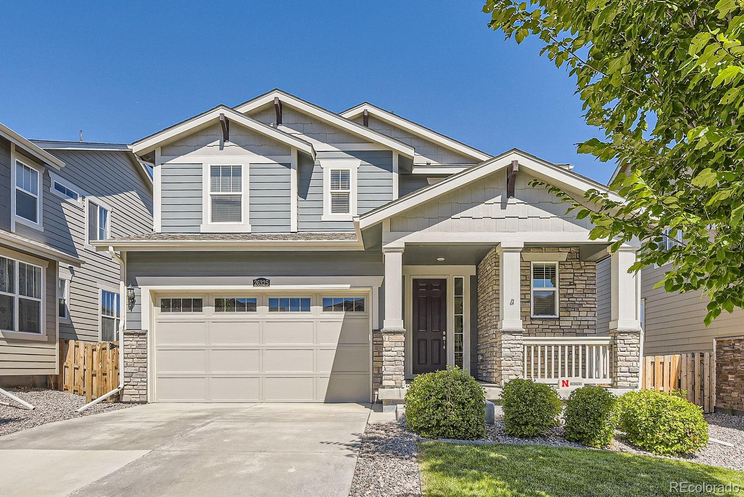 a front view of a house with a garage