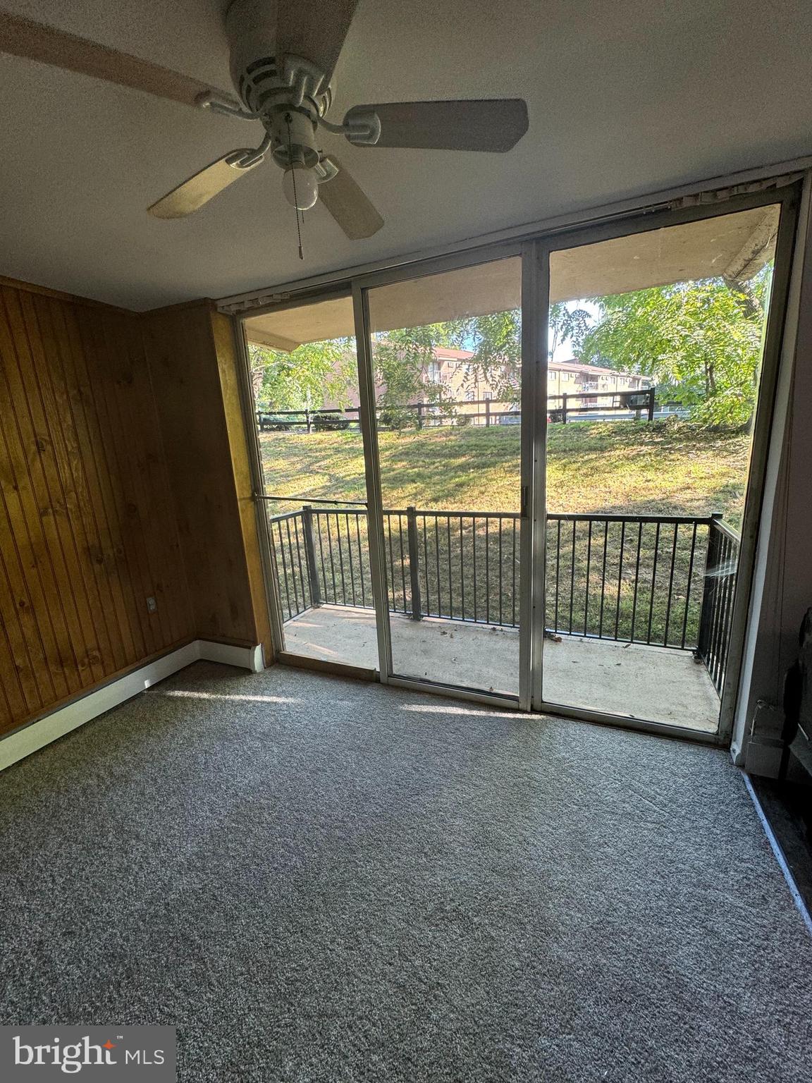 a view of empty room with floor to ceiling window