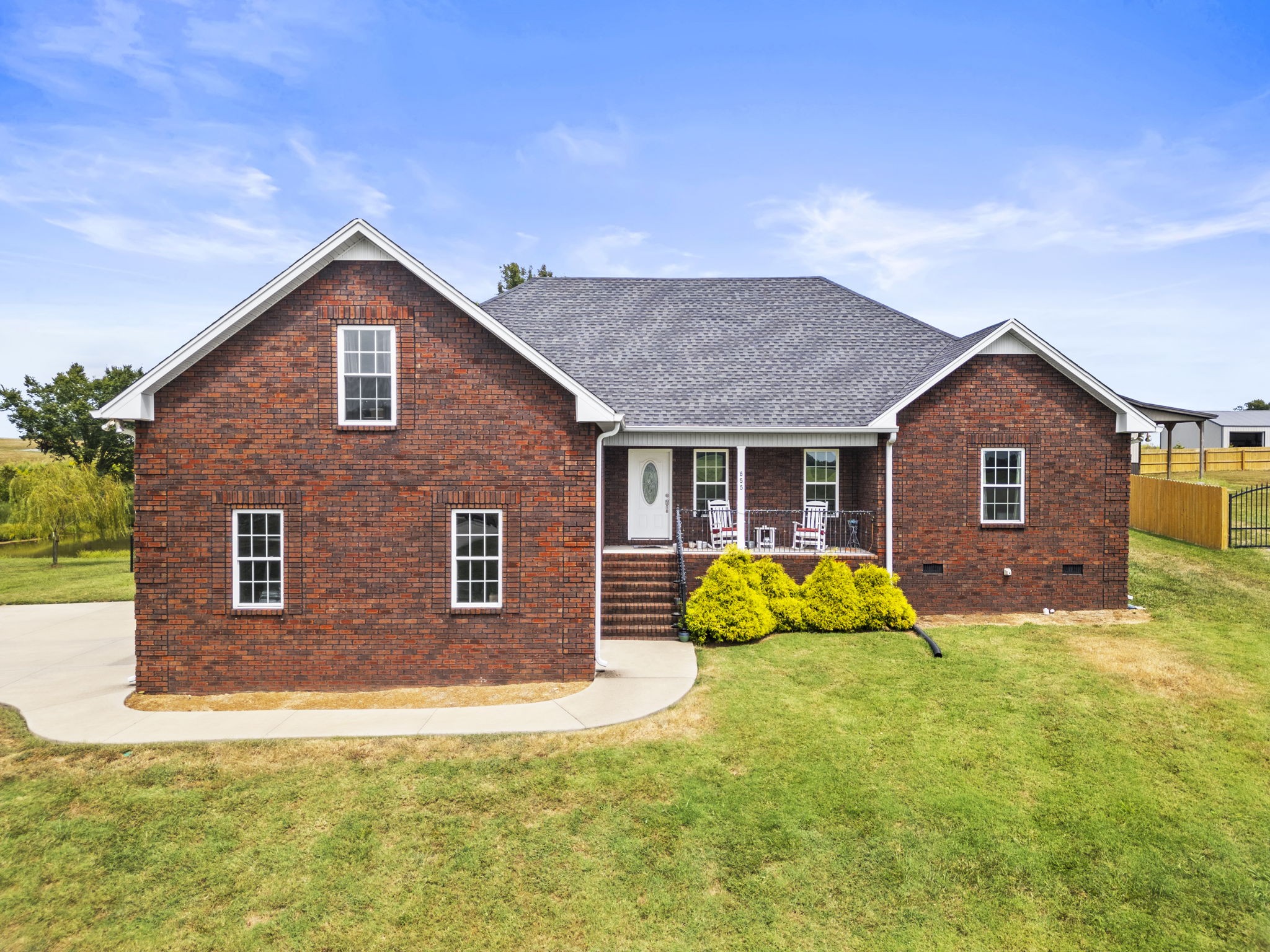 a front view of a house with yard