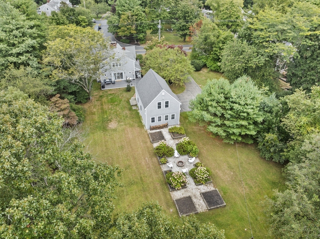 an aerial view of house with yard swimming pool and outdoor seating