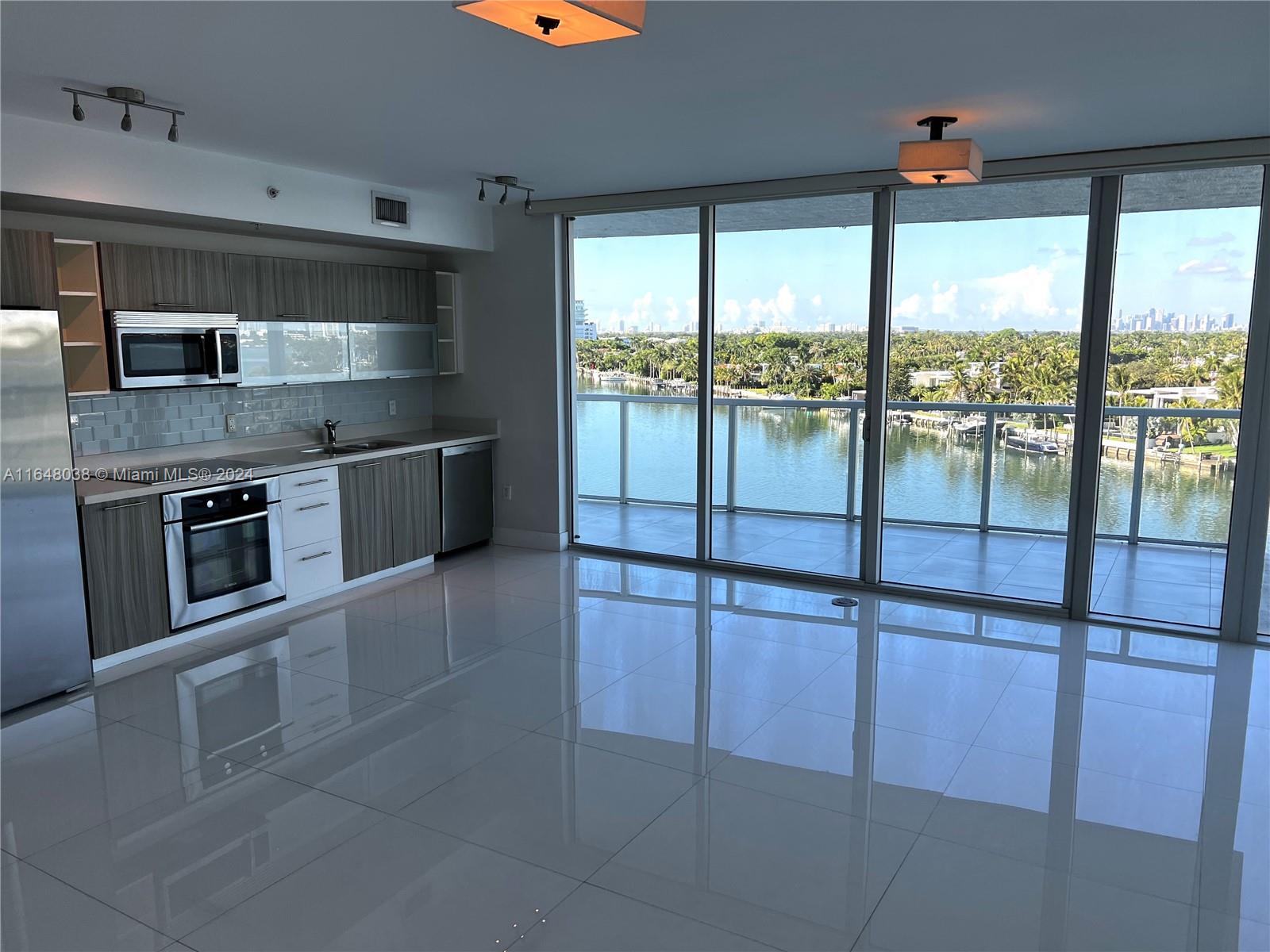 a kitchen with stainless steel appliances granite countertop a stove and a sink