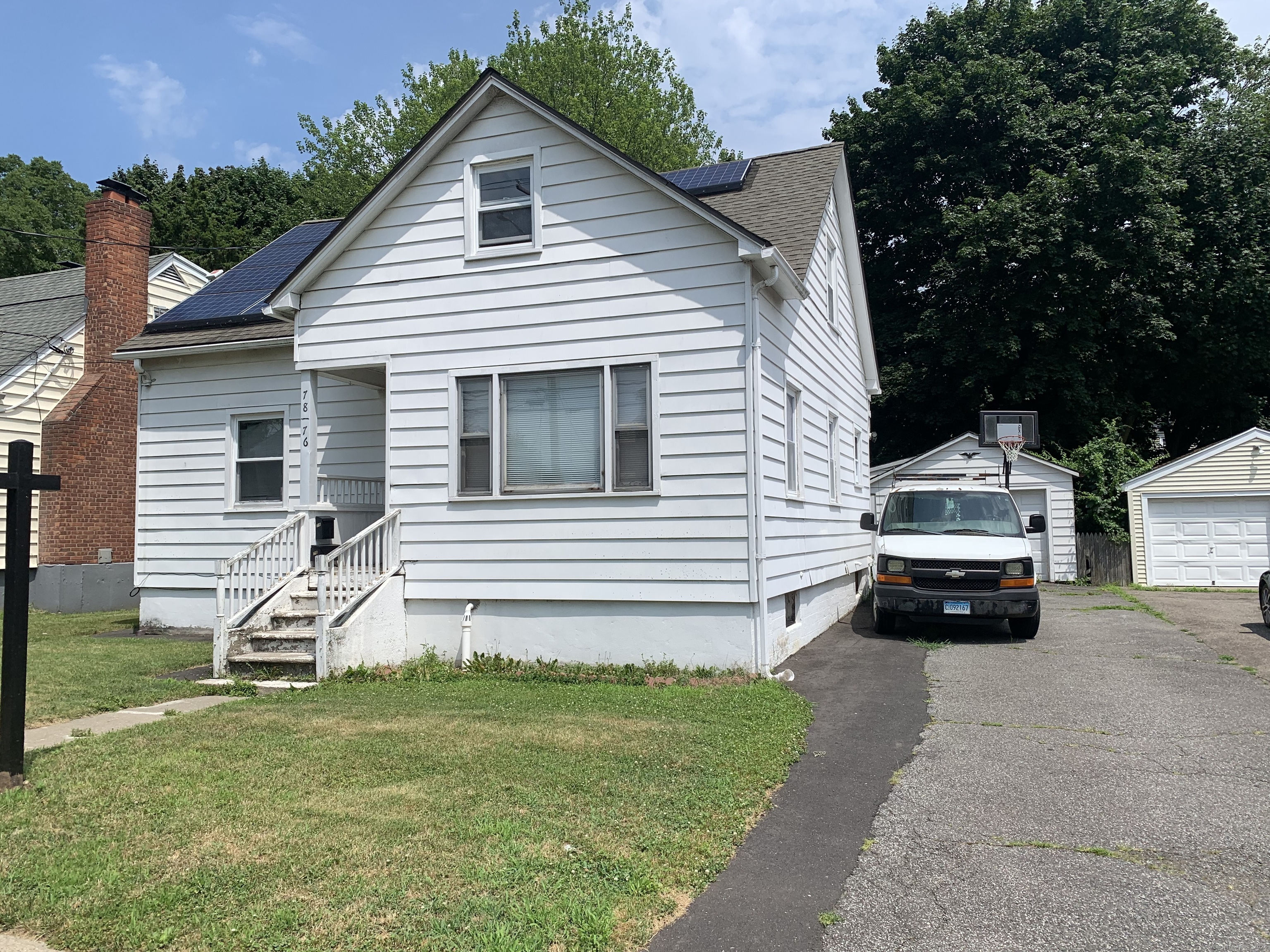 a car parked in front of a house