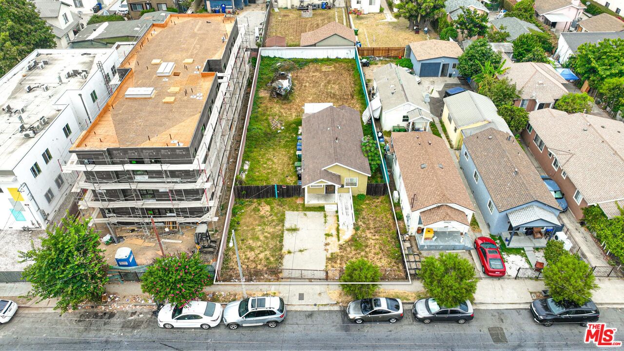 an aerial view of multiple houses with outdoor space