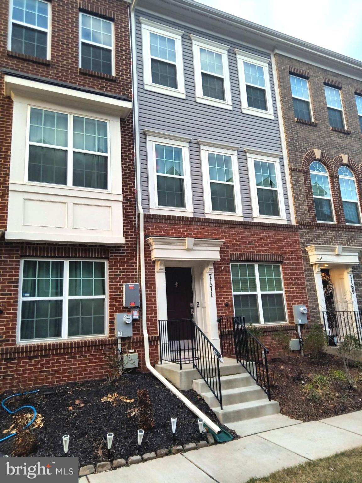 a view of a brick building with many windows