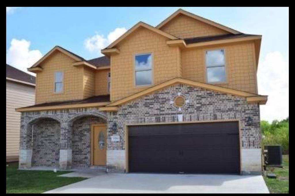 a front view of a house with yard