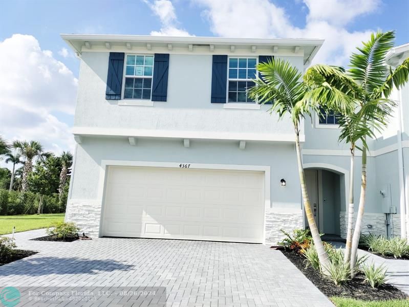 a front view of house with yard