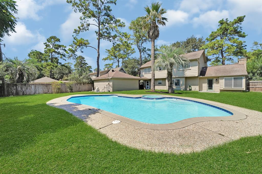 Escape to your private oasis with a luxurious heated pool, surrounded by swaying palm trees and a serene, beautifully landscaped backyard. This tranquil retreat offers the perfect setting for relaxation and outdoor enjoyment year-round.