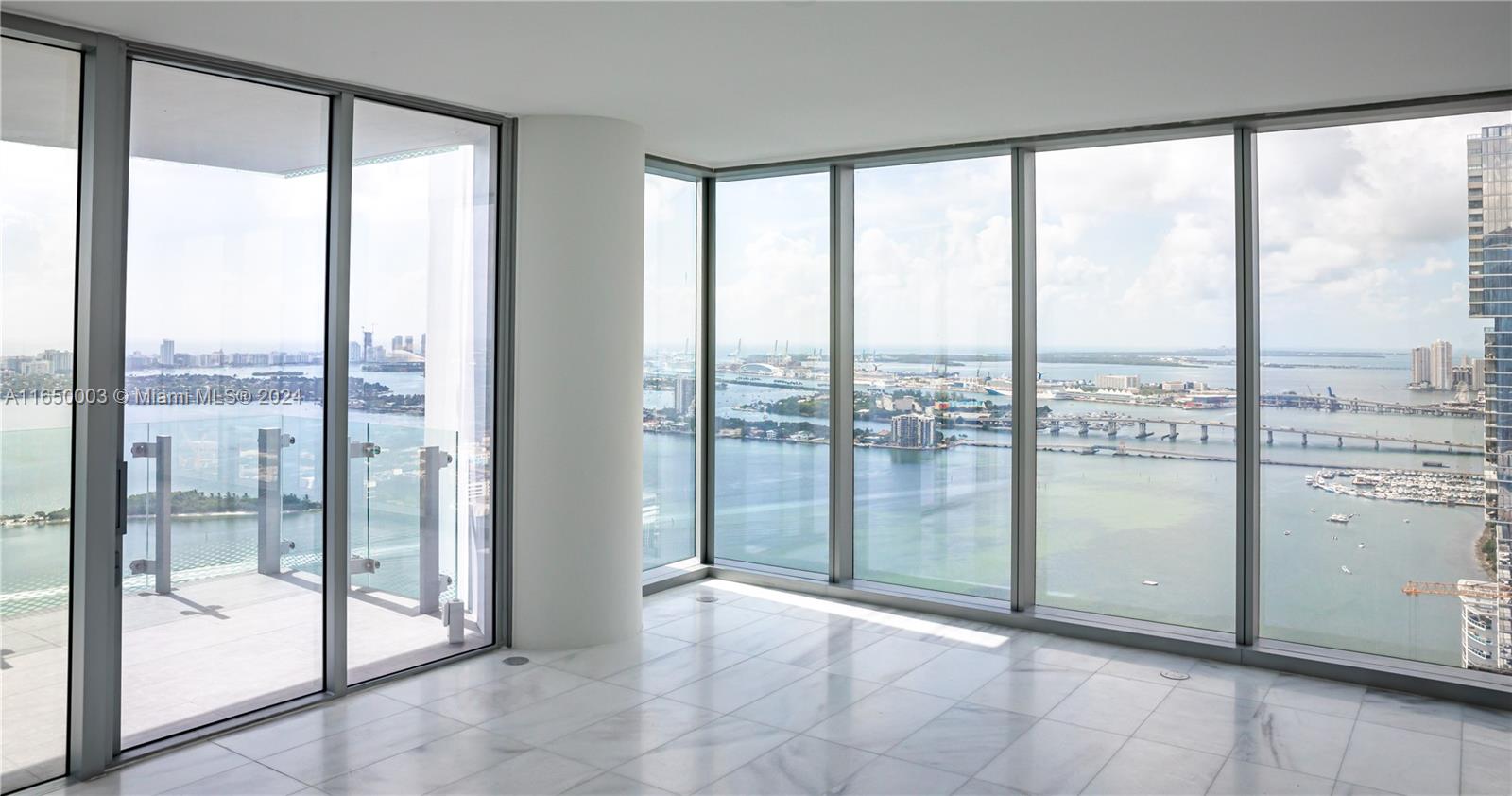 a view of a glass door and the balcony