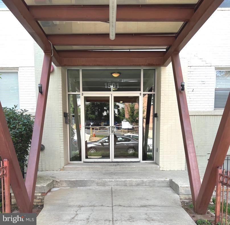 a view of a porch with wooden floor and stairs