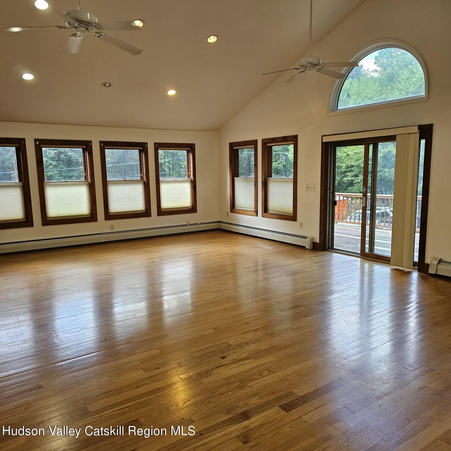 a view of an entryway with wooden floor