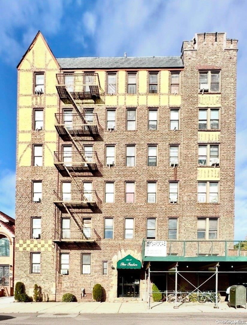 a front view of a building with glass windows