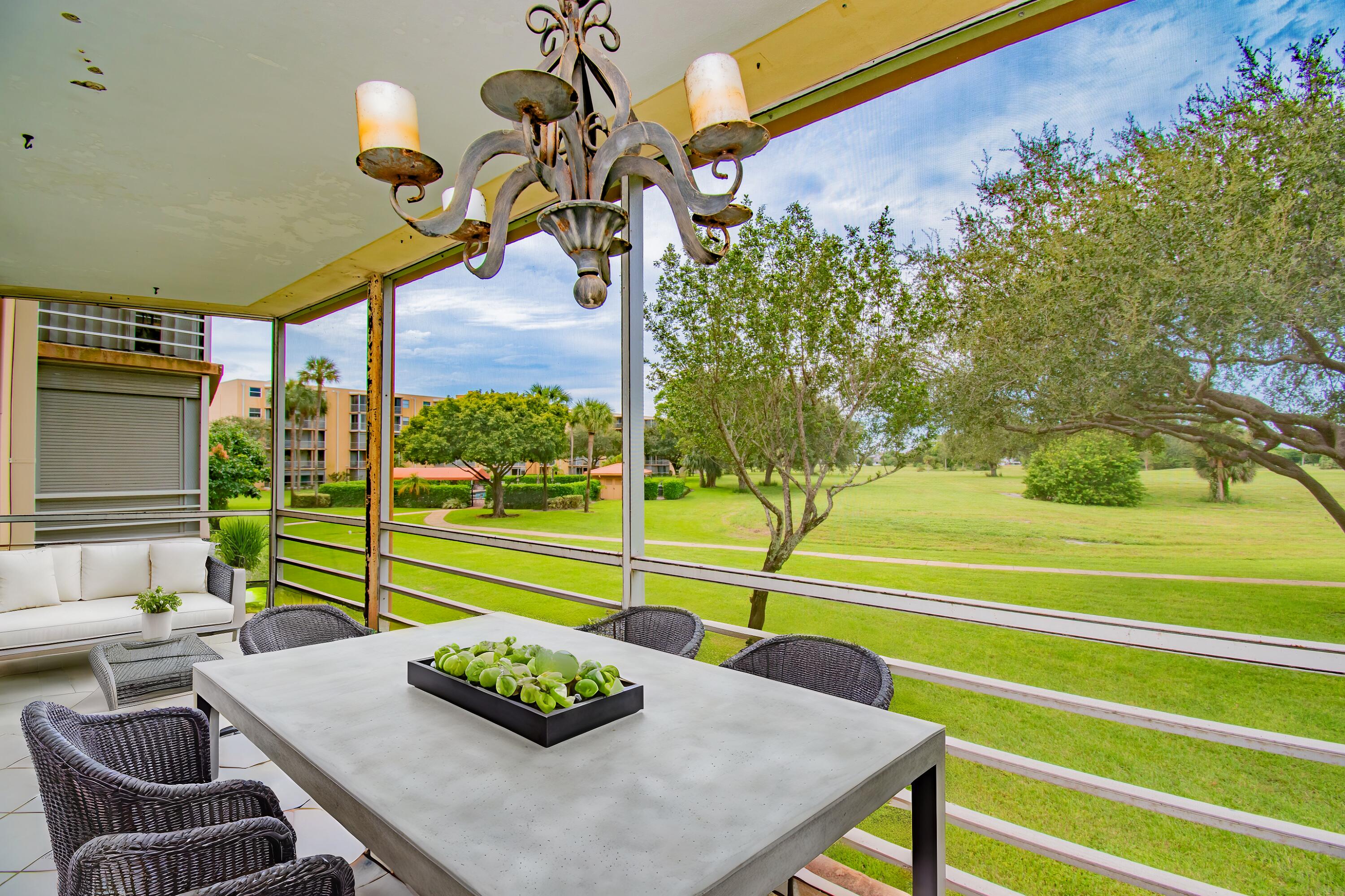 a view of an outdoor kitchen and outdoor seating