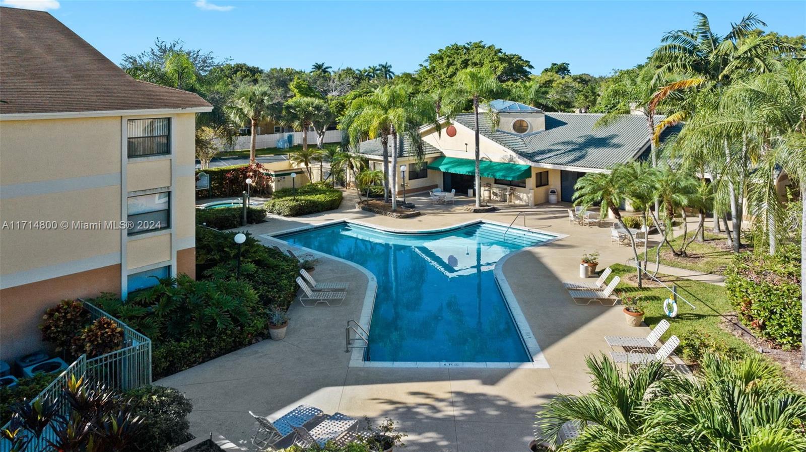 a view of a backyard with sitting area