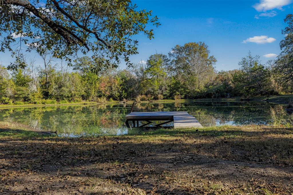 a view of a lake with a yard