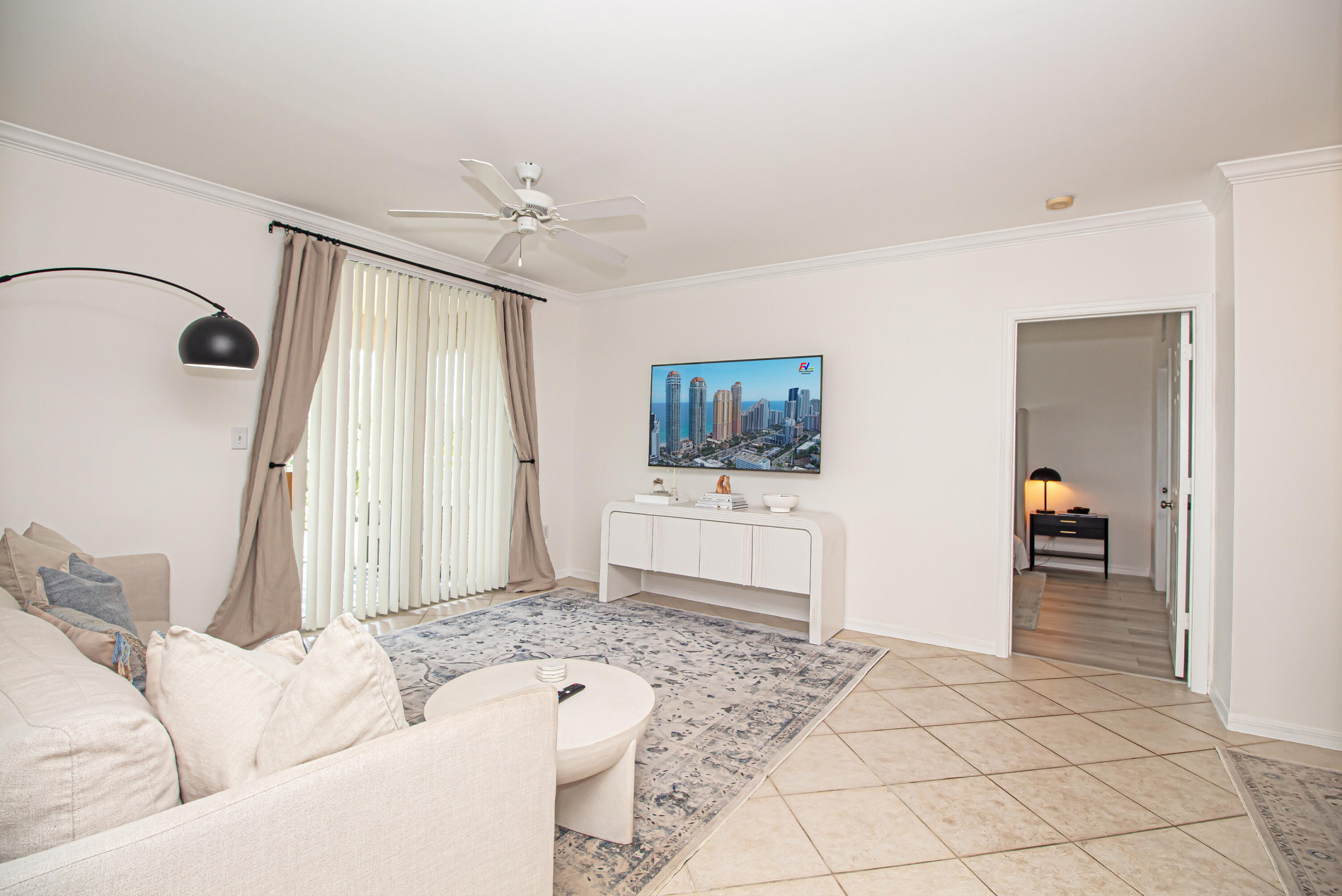 a living room with furniture and a flat screen tv