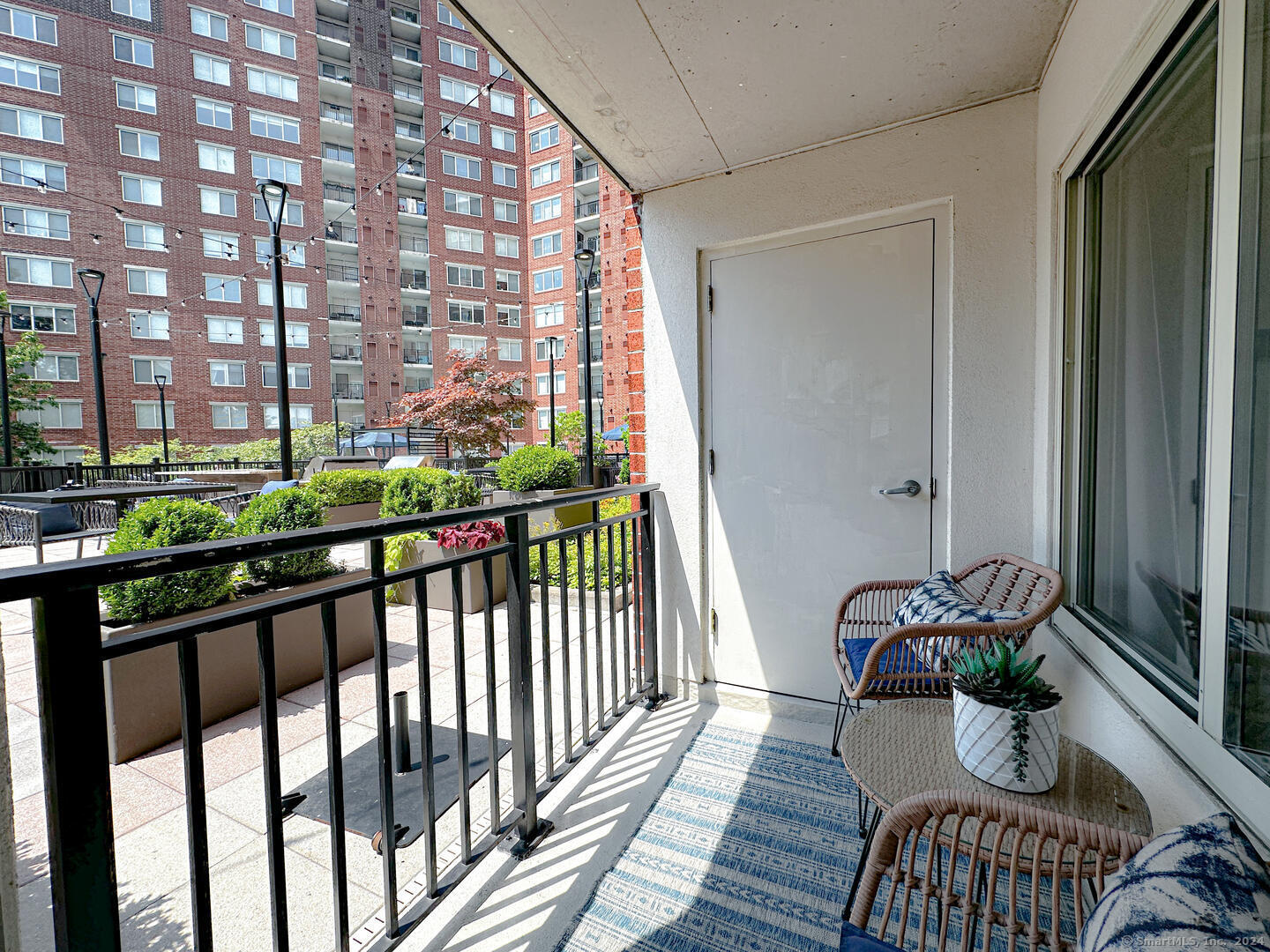 a view of balcony with a potted plant