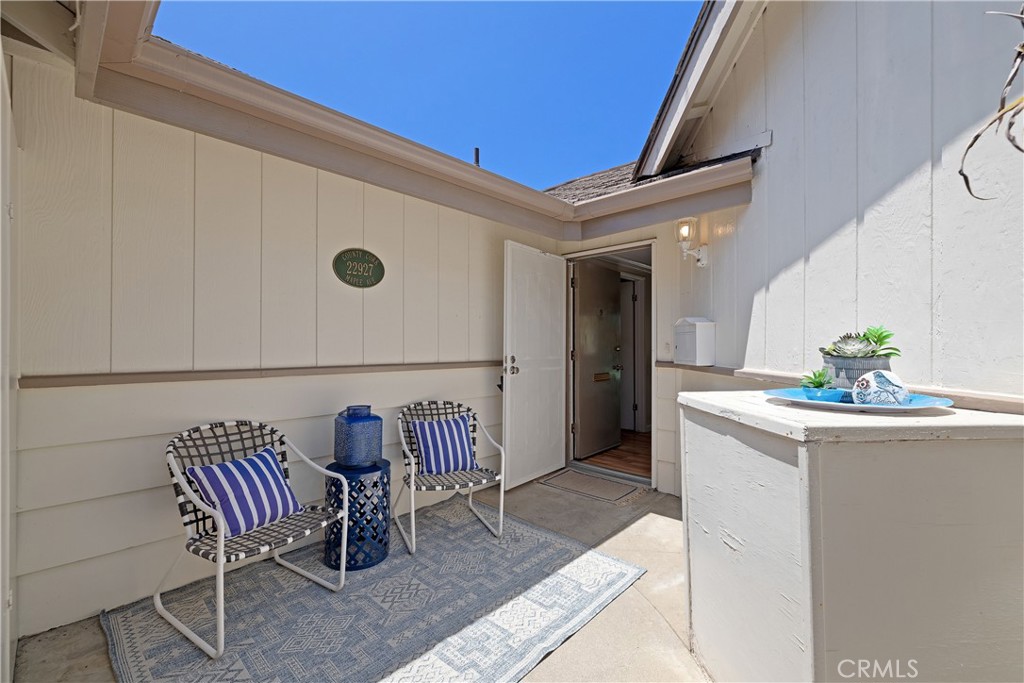 Front patio and entry. Security screen door for fresh air breezes while maintaining safety and security.