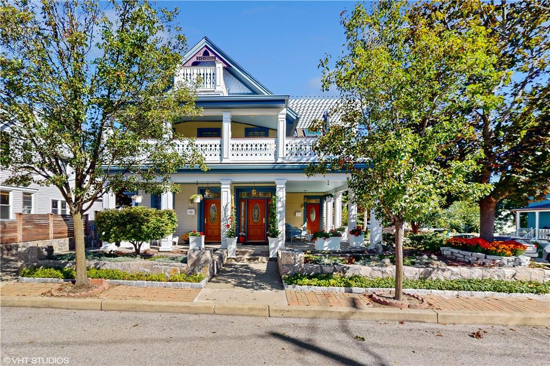 a front view of a house with street view