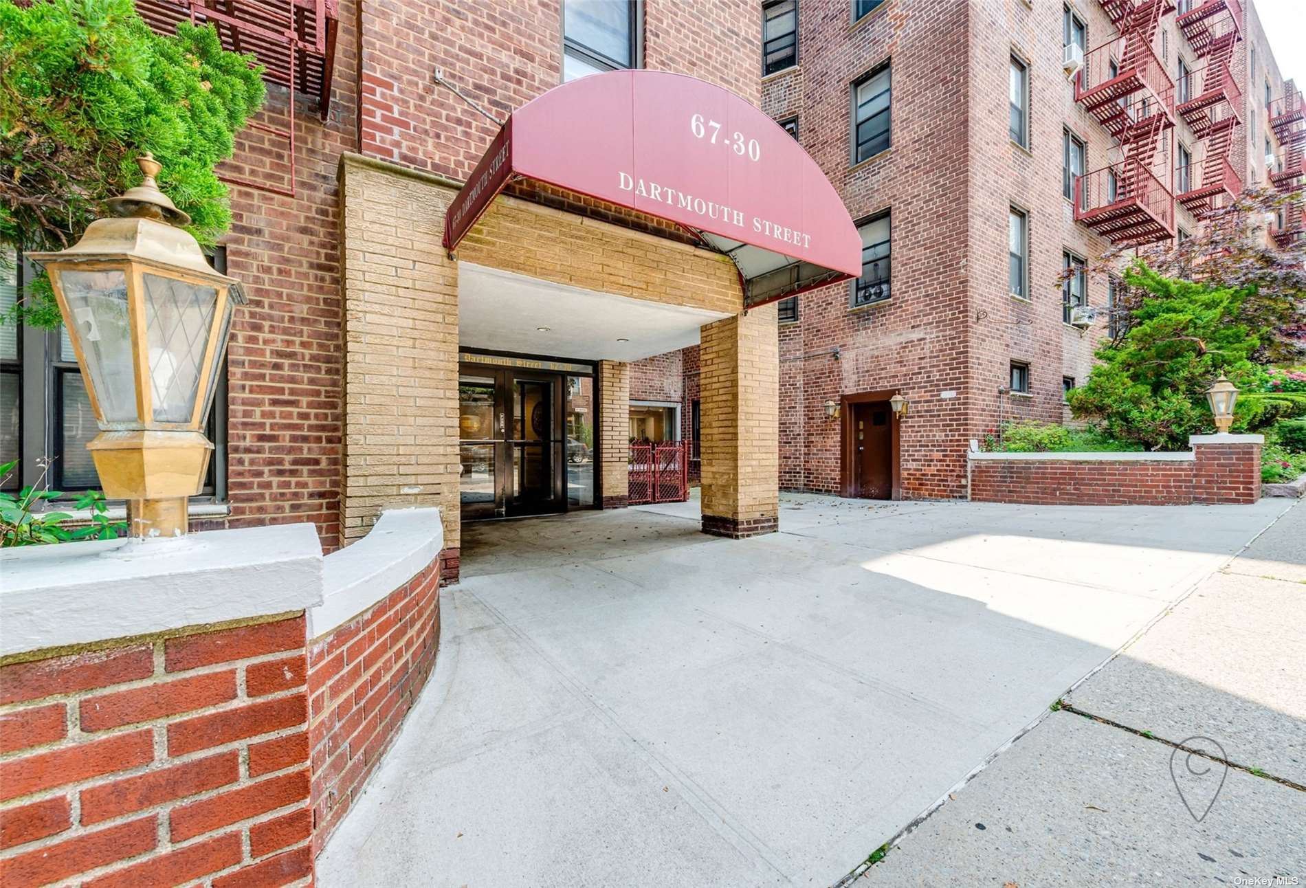 a front view of a building with brick walls