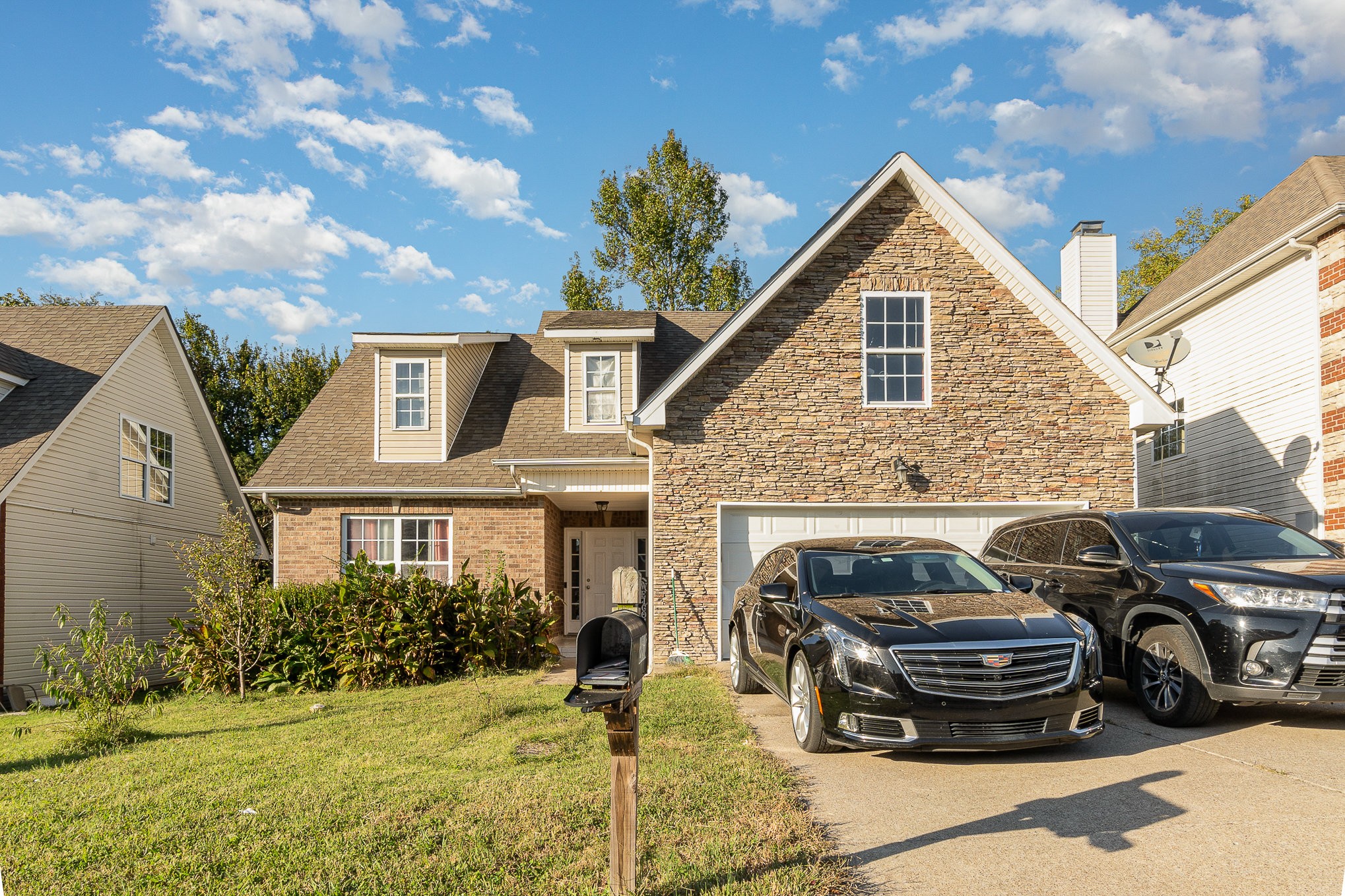 a view of a car parked in front of a house