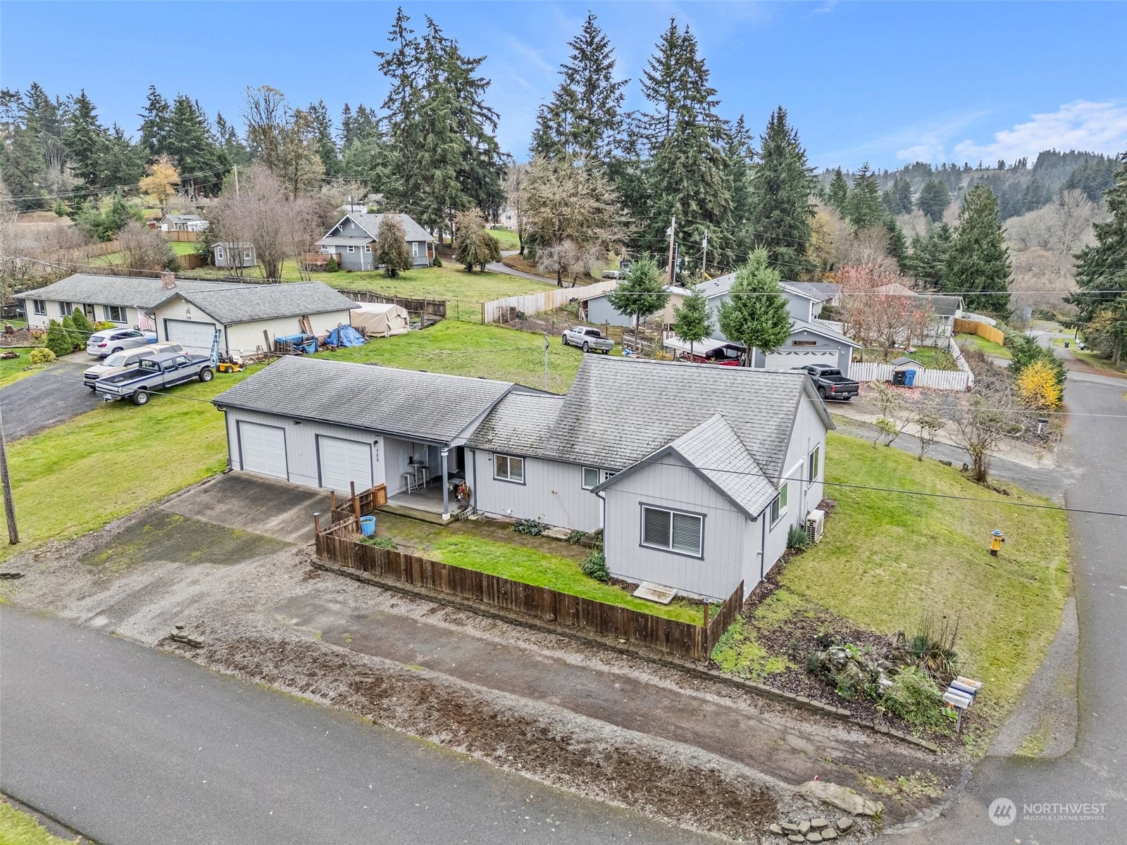 an aerial view of a house with a big yard