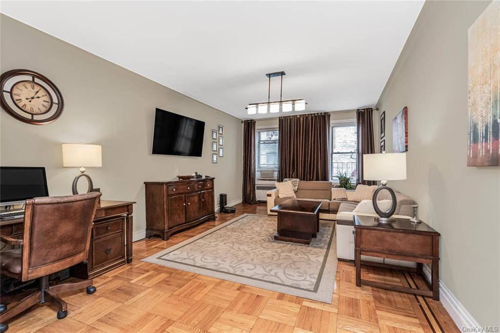 Living room featuring light parquet floors