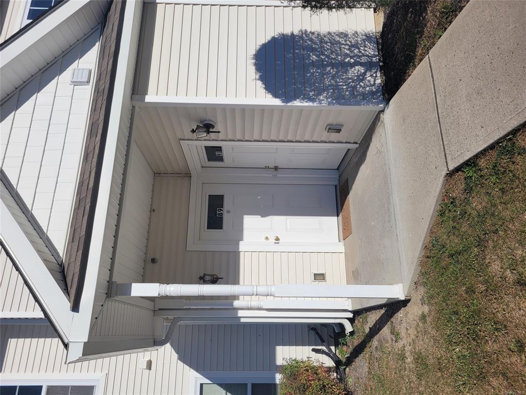 Property entrance with a porch