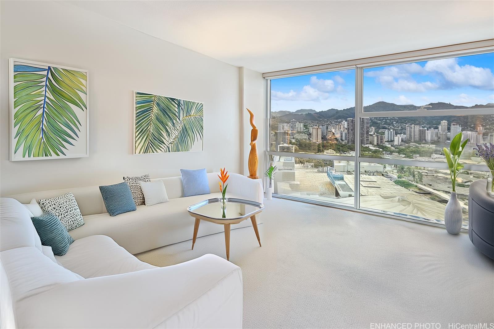 a living room with furniture and a floor to ceiling window